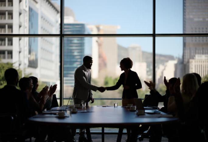 people-shaking-hands-in-boardroom.jpg