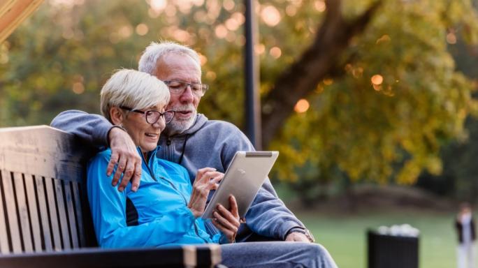 A retired couple on a bench