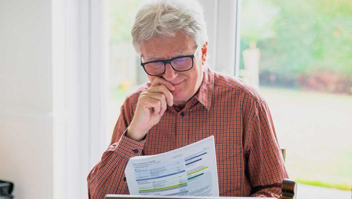Man looking at tax paperwork