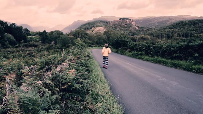 A person walking along a road