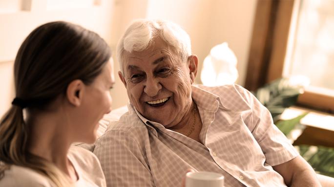 Man talking to his granddaughter