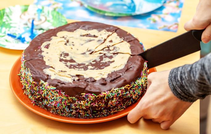 Cake being cut into slices