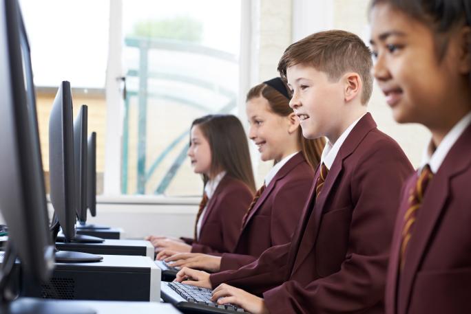 Children in class working