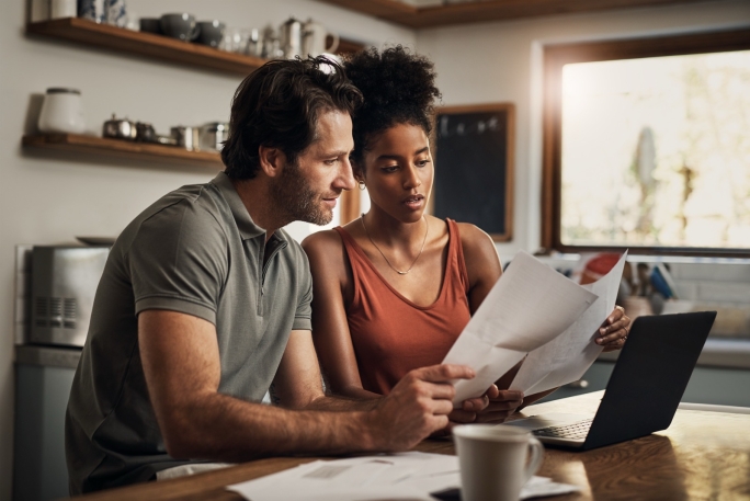 Couple looking at statements