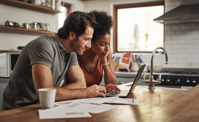 Couple looking at laptop screen