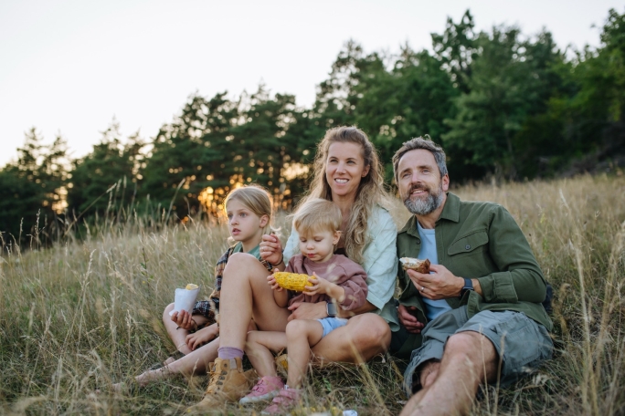 A family sitting on grass