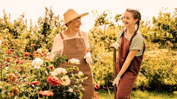 Lady gardening with grandchild