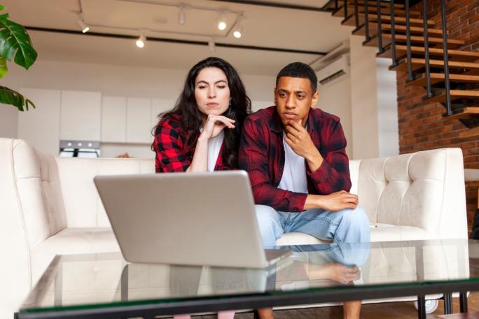 Man and woman looking at banking details