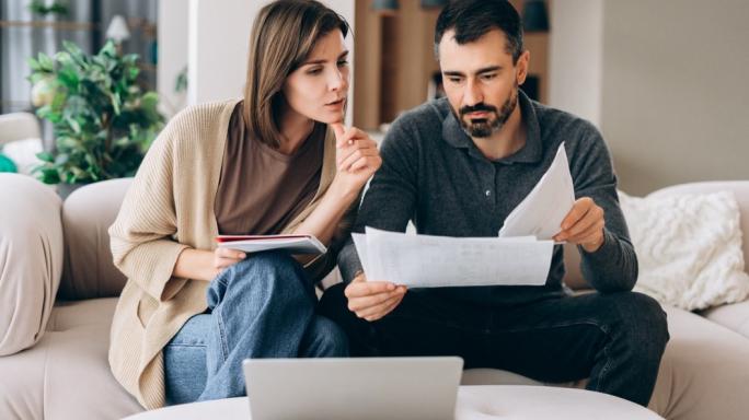 Man and woman looking at finances