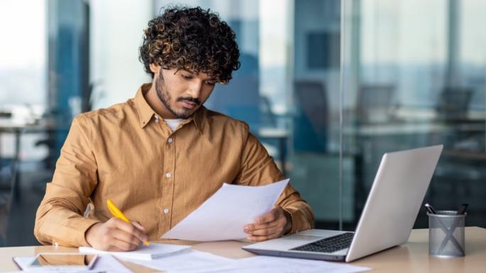 A man looking at his finances online