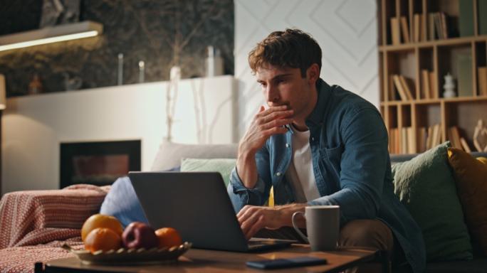 Man looking at laptop