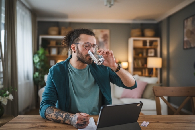 Man on computer choosing products