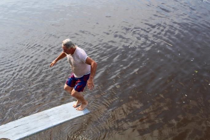 Man about to dive into water