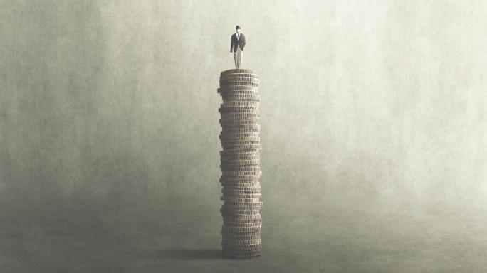 A man standing on a pile of money