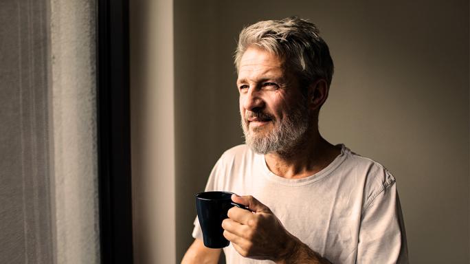 A man relaxing with a drink