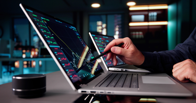 Man with digital pen on laptop