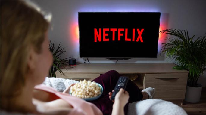 Woman watching Netflix on TV