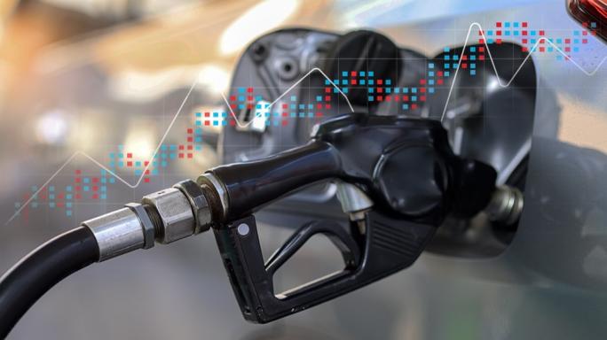 Petrol pump with chart behind it