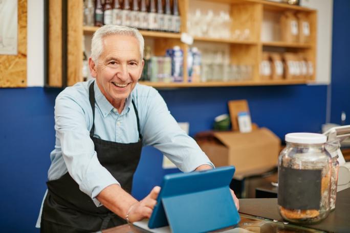 Senior man working in a shop
