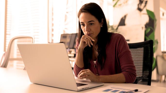 Woman looking at computer screen