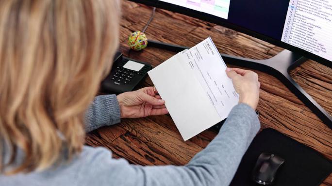 Woman opening her paypacket