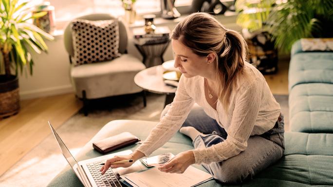 Woman paying bills online