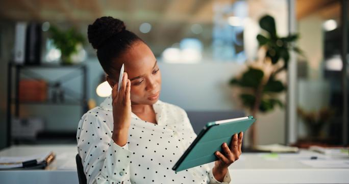 Woman reading tablet