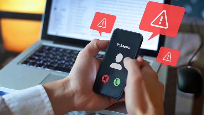 A phone and computer showing a potential scam