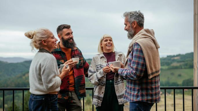 cheerful friends together in the mountains