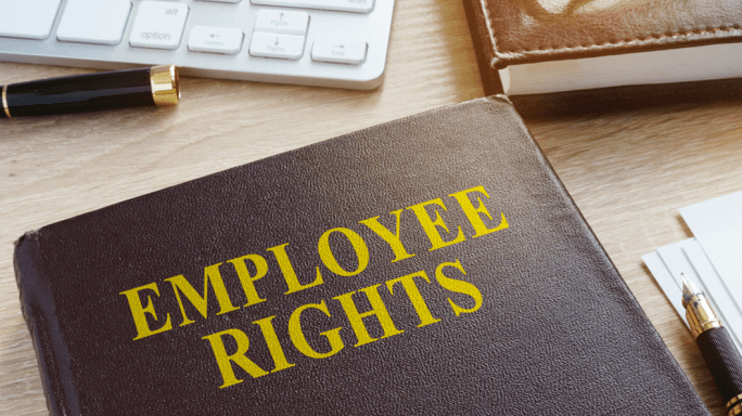 Employee rights handbook on a desk
