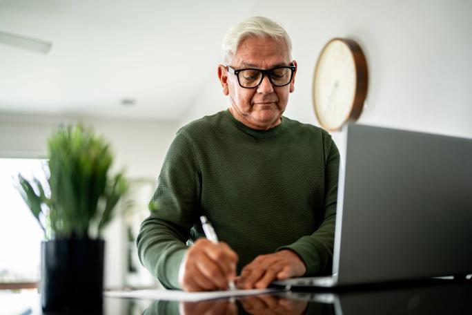 man using laptop at home
