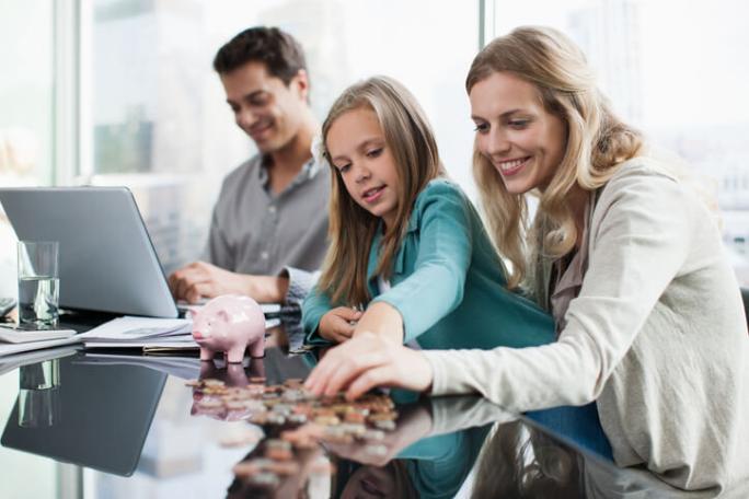 mother and daughter counting coins