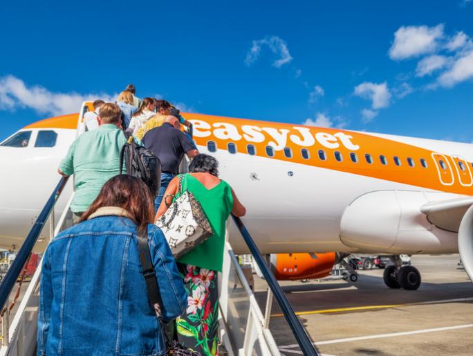 people boarding easyjet plane