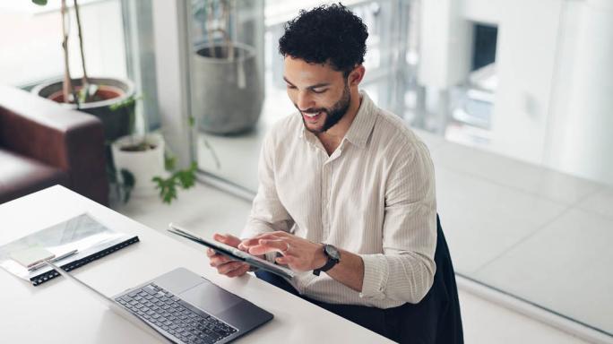 person using tablet in an office