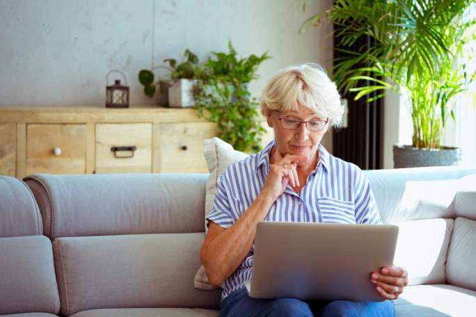 senior woman using laptop at home