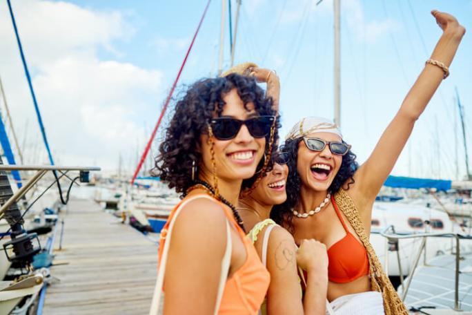 three friends out on a sailing adventure