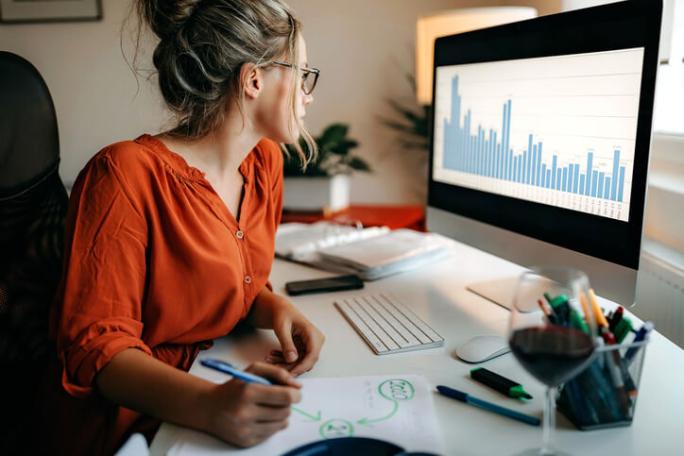 woman doing research on computer