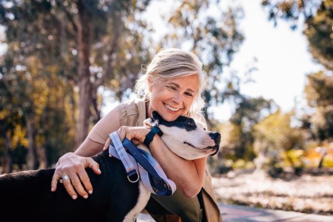 woman hugging a dog