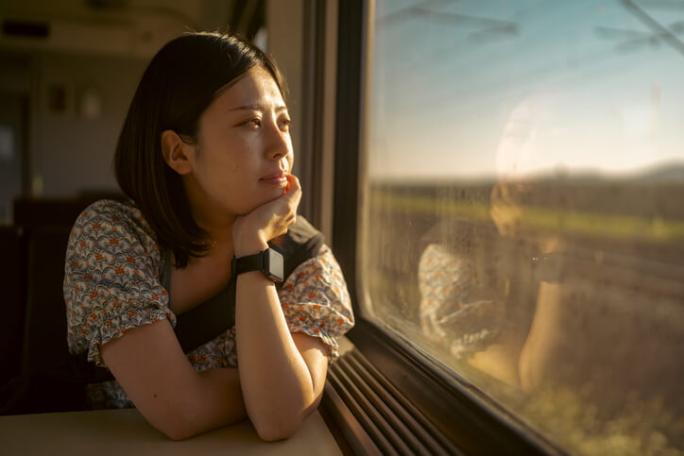 woman thinking on train