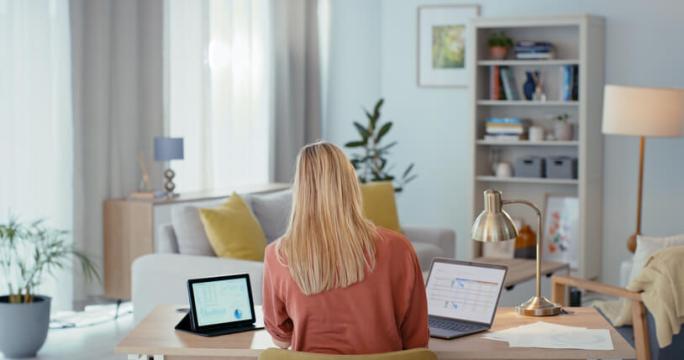 woman using laptop in her living room