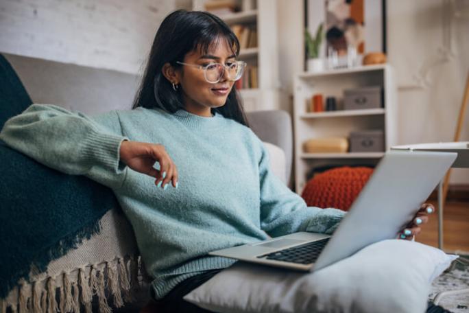 woman using laptop in modern home
