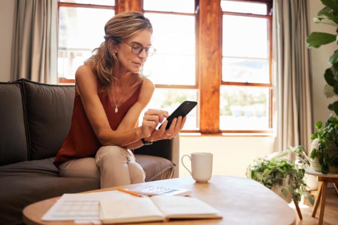 woman using a phone at home