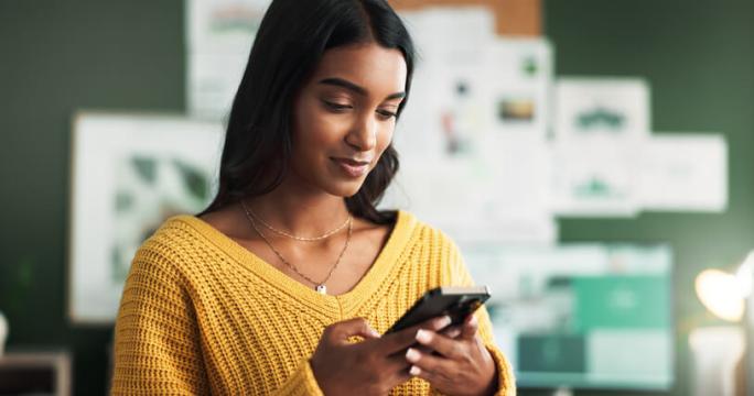 woman using smartphone at home