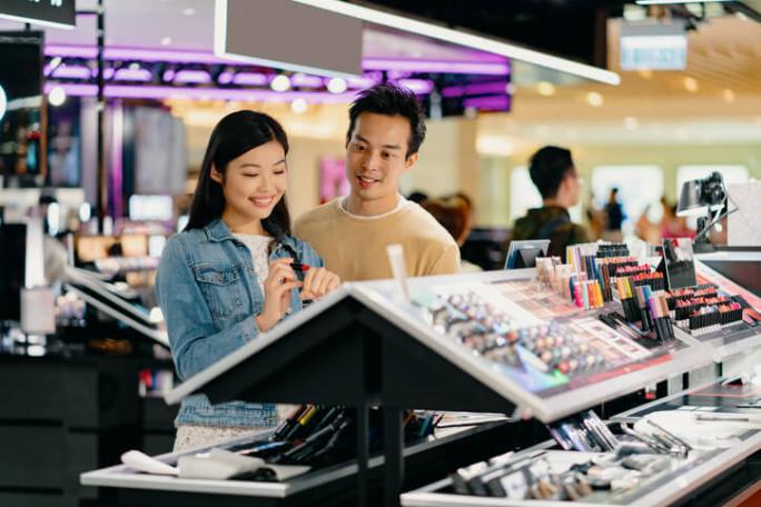 young couple shopping for makeup