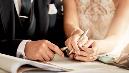 married-couple-signing-papers.jpg