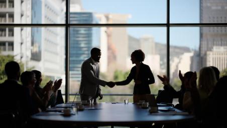 people-shaking-hands-in-boardroom.jpg