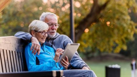 A retired couple on a bench
