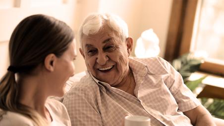 Man talking to his granddaughter