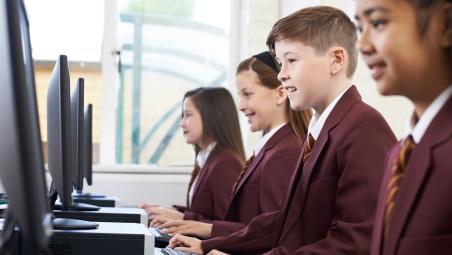 Children in class working
