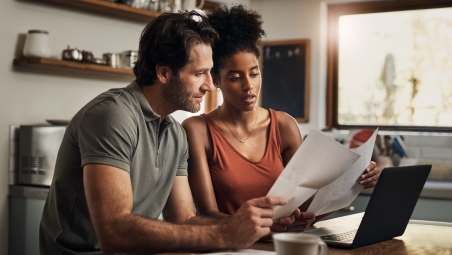 Couple looking at statements
